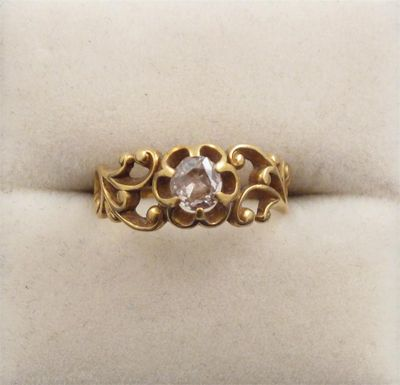 A diamond solitaire ring The cushion shaped diamond is set