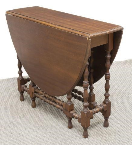English mahogany drop leaf table 20th c having oval top