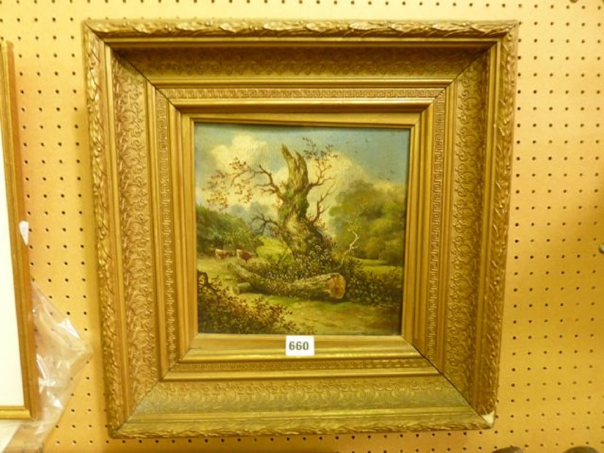 A 19th century oil painting on board of a landscape