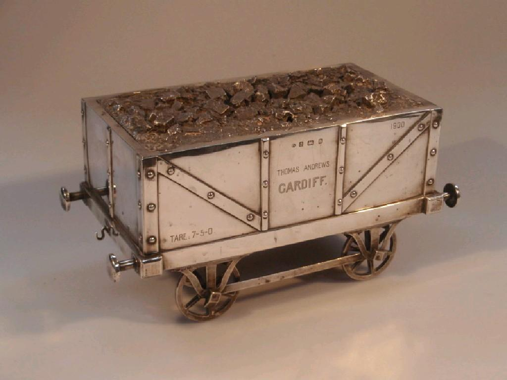 An Edwardian silver table cigarette box in the form of