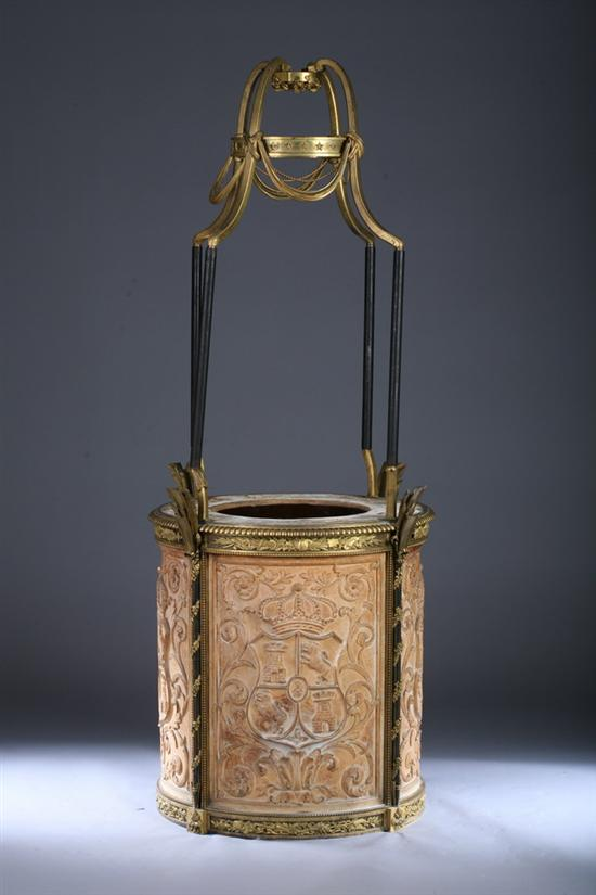 CONTINENTAL GILT BRASS MOUNTED BAS RELIEF CAST COMPOSITION WISHING WELL