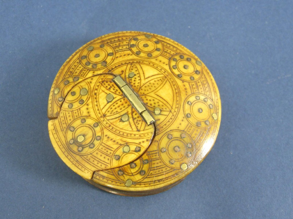 A 19th Century circular horn Snuff Box with engine turning