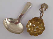 A Victorian silver caddy spoon with fruit embossed lobed bowl