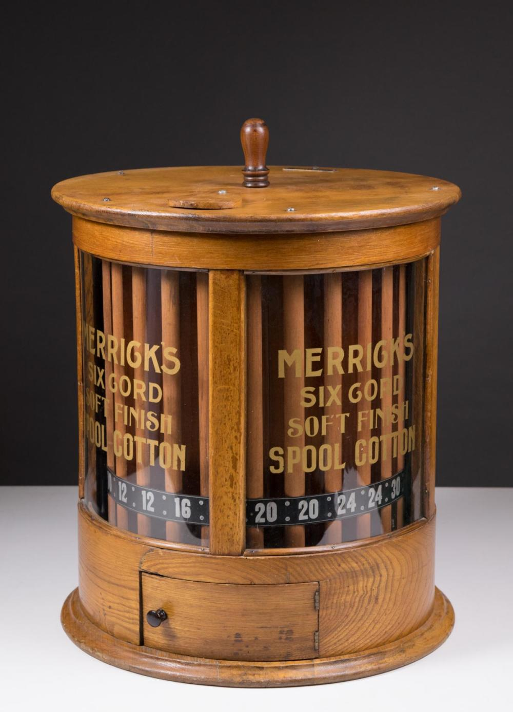 CYLINDRICAL OAK AND CURVED GLASS SPOOL CABINET Merrick Thread Co