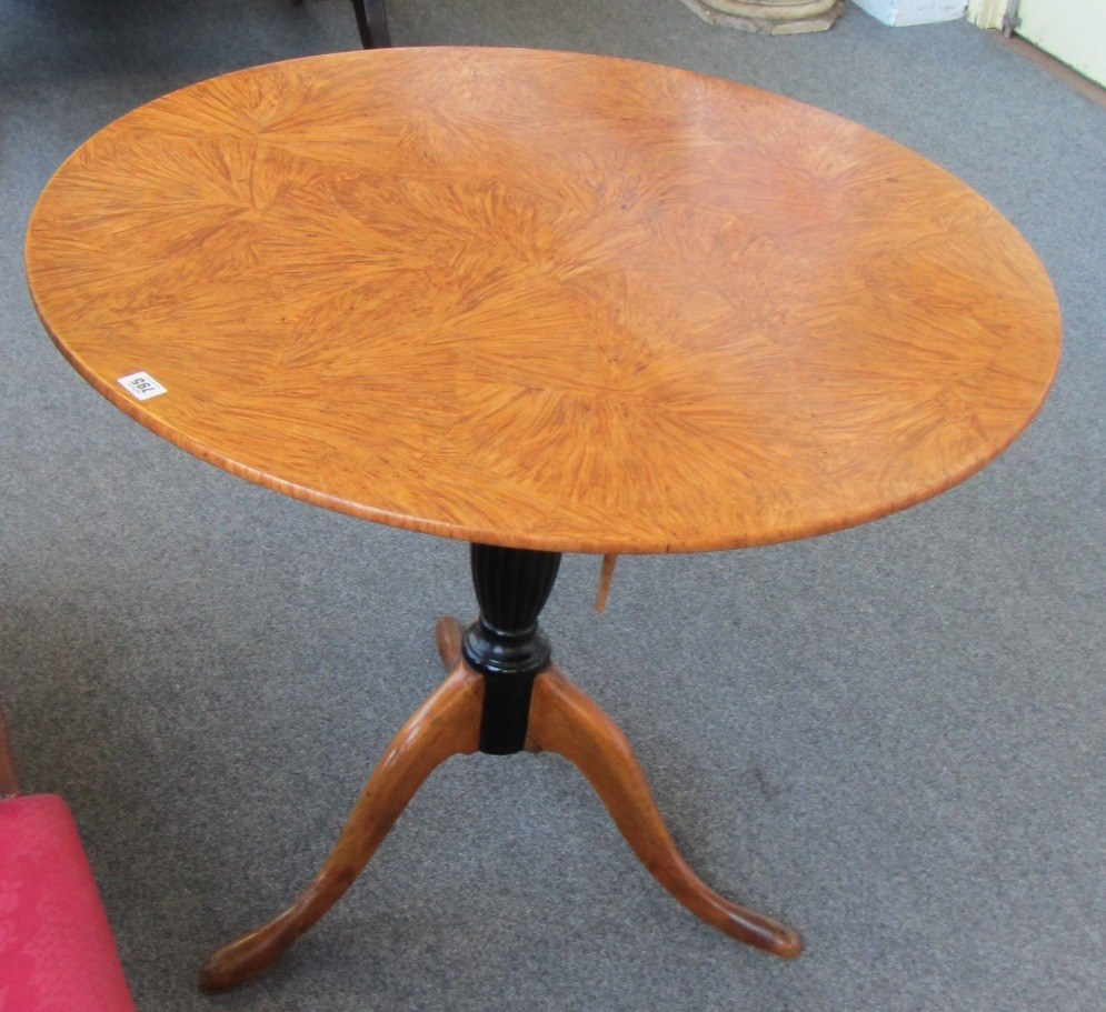 A Scandinavian figured satin birch and ebonised circular snap top