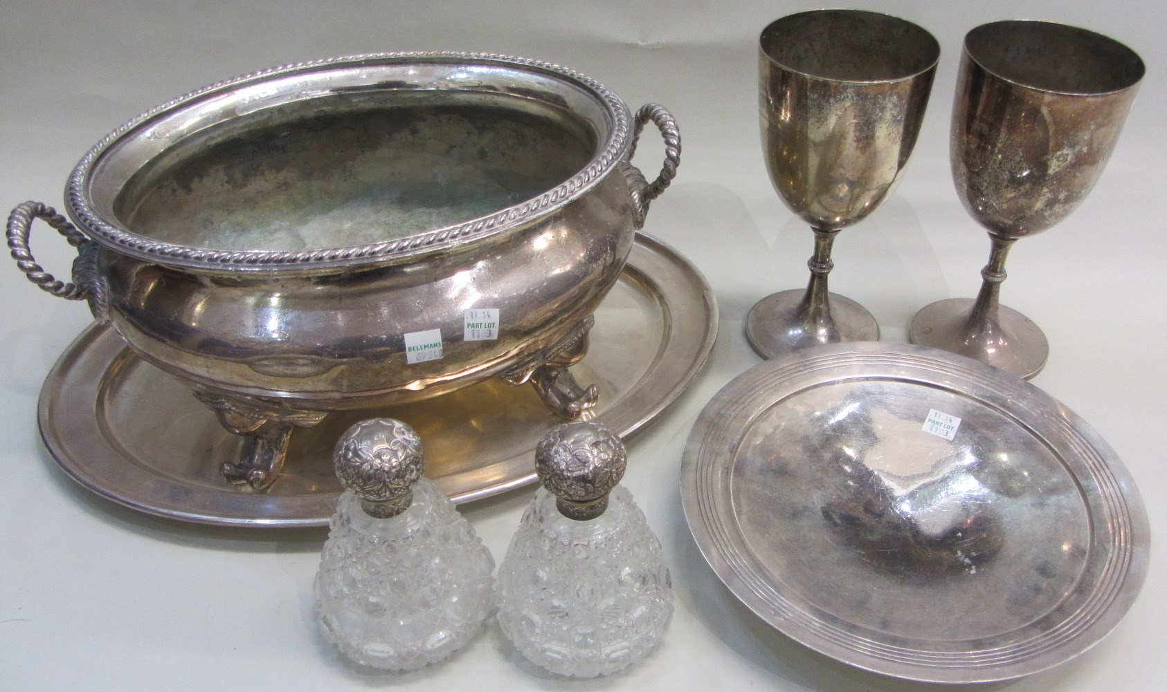Two similar Victorian silver mounted faceted glass scent bottles the
