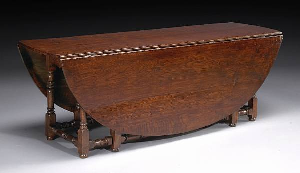 An imposing William and Mary style oak gateleg table partially