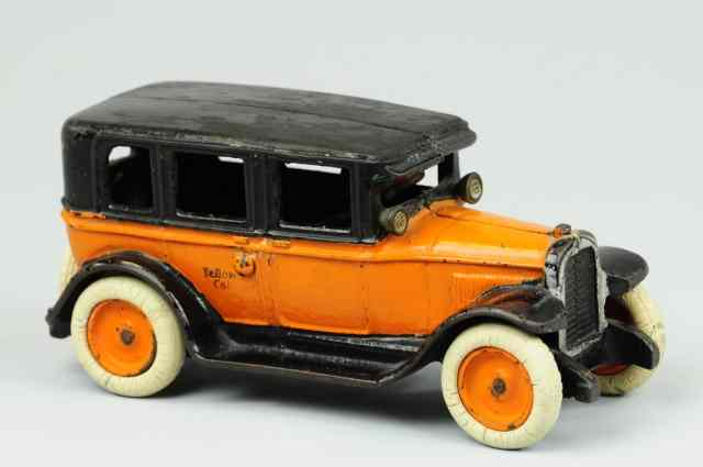 ARCADE FLAT TOP TAXI Cast iron taxi done in orange