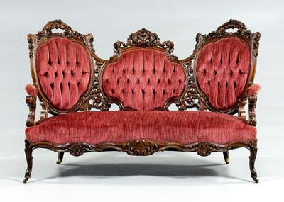 Rococo revival carved rosewood sofa elaborately pierced and florally carved