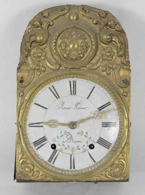 A French wall clock with embossed brass surround fitted a
