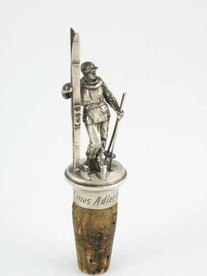 Skiing A German electroplated mounted bottle cork surmounted by the