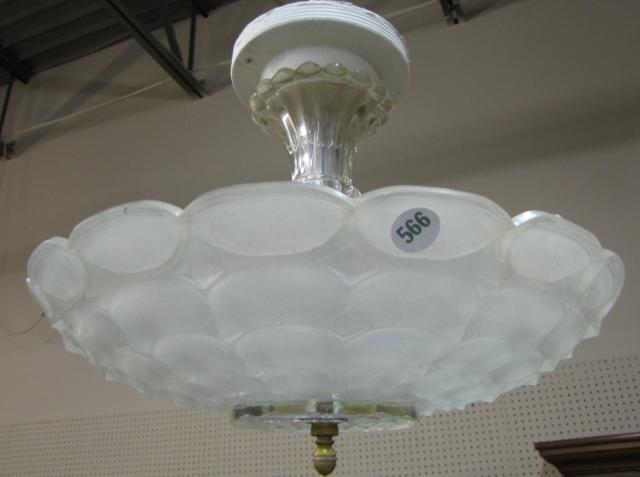 Two hanging ceiling light fixtures with glass shades from Arts