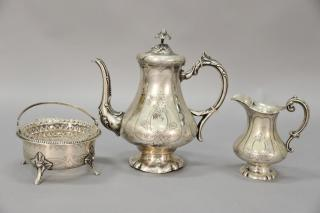 Silver three piece tea set with teapot creamer and waste