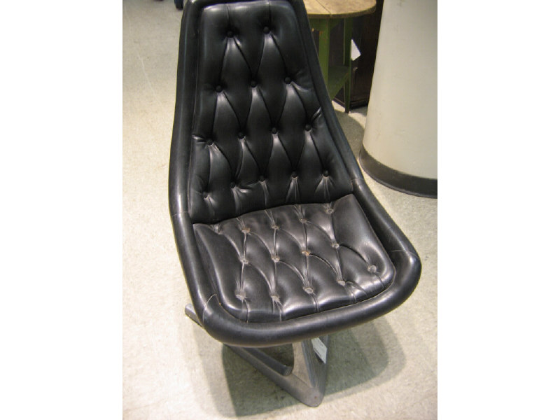 MANNER OF VLADAMIR KAGAN Pair of black vinyl upholstered swivel