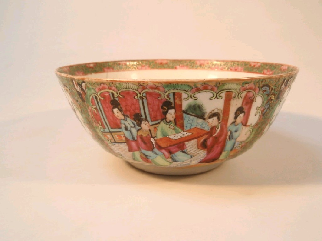 A 19thC Chinese famille rose bowl painted with reserves of