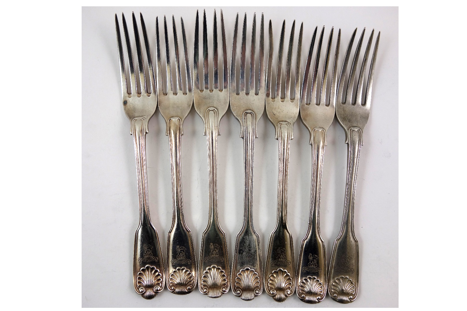 Seven Victorian silver fiddle thread and shell pattern dessert forks
