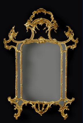 ITALIAN CARVED GILTWOOD MIRROR The mirror plate enclosed by subsidiary