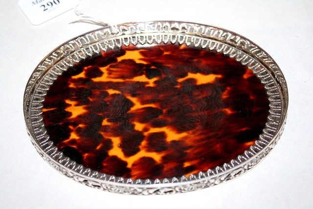 A SILVER AND TORTOISESHELL OVAL TRAY shell base with a