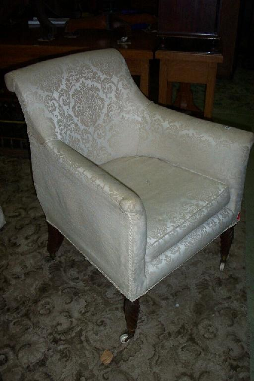 An early 19th century Irish drawing room chair with shaped
