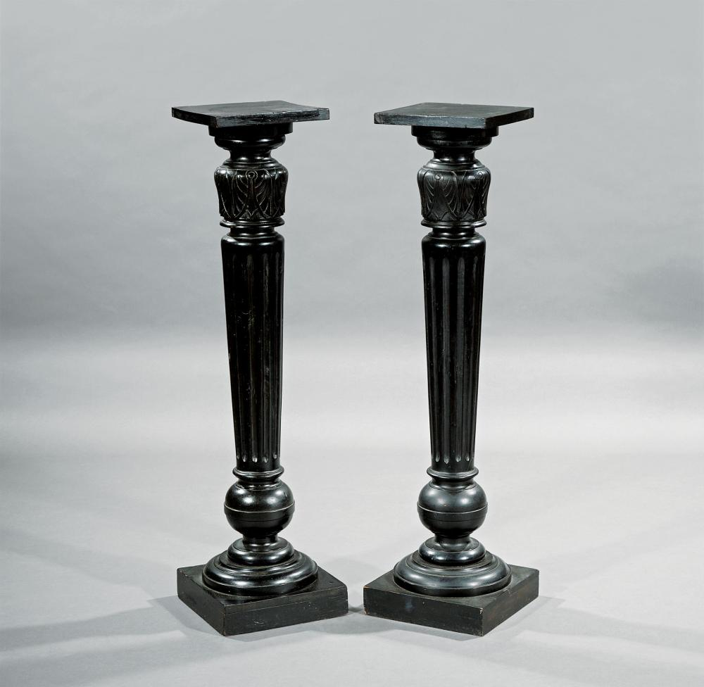 Pair of Neoclassical Style Carved and Ebonized Pedestals each with