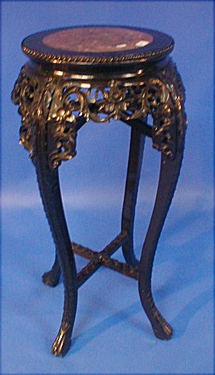 A Chinese carved rose wood jardiniere stand with marble inset