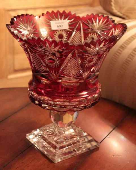 A RUBY FLASH GLASS VASE with shaped flaring rim faceted