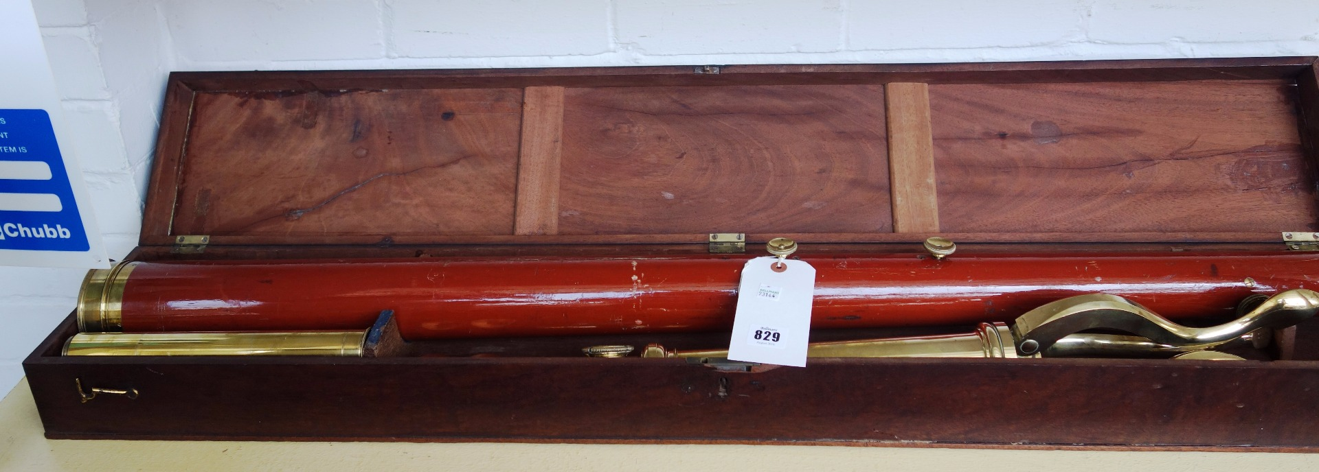 A three inch Dollond brass and mahogany refracting telescope on