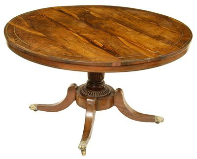 A late Regency rosewood and brass inlaid breakfast table the