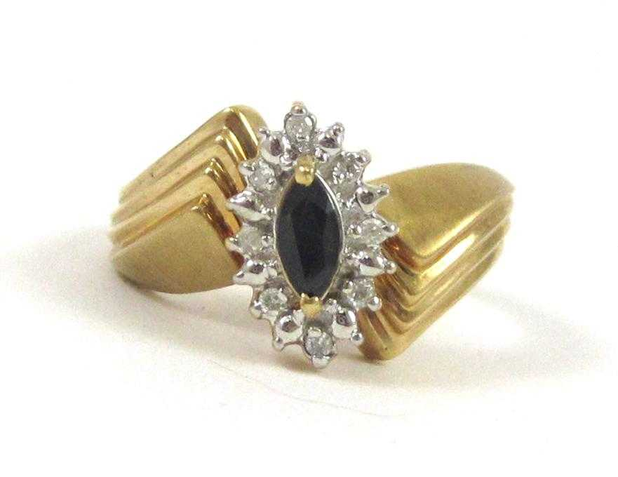 SAPPHIRE DIAMOND AND TEN KARAT GOLD RING with eight round
