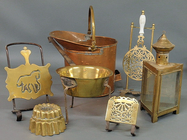Seven pieces of metalware copper tin posnet pot brass mold