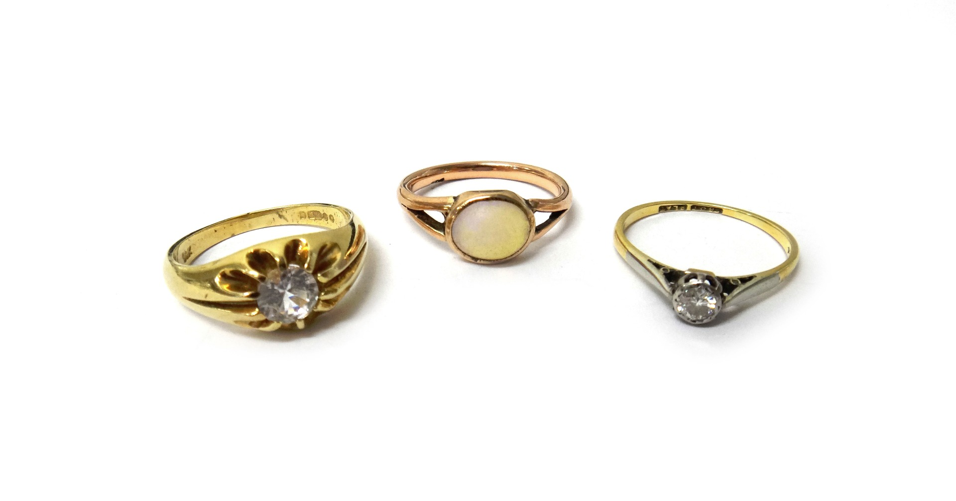A gold and platinum diamond set single stone ring mounted