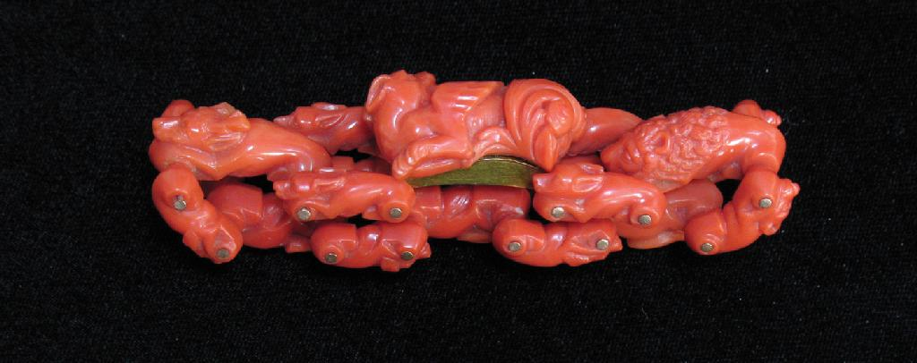 A VICTORIAN CORAL BRACELET each link carved as a rabbit