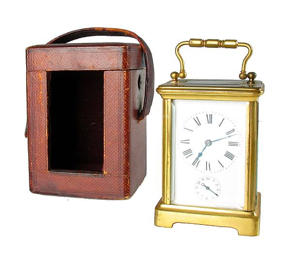 A French gilt brass carriage timepiece in a corniche case