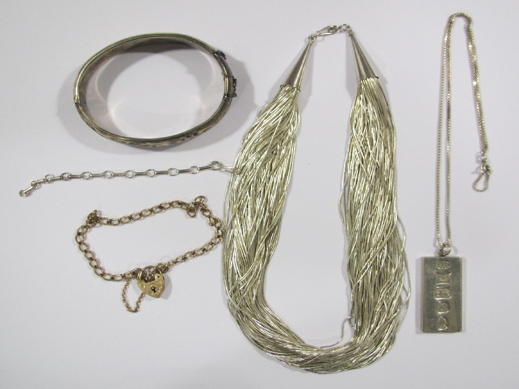 Lot comprising a rolled gold curb link bracelet silver bangle