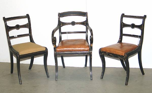 A set of five Regency ebonized dining chairs comprising one