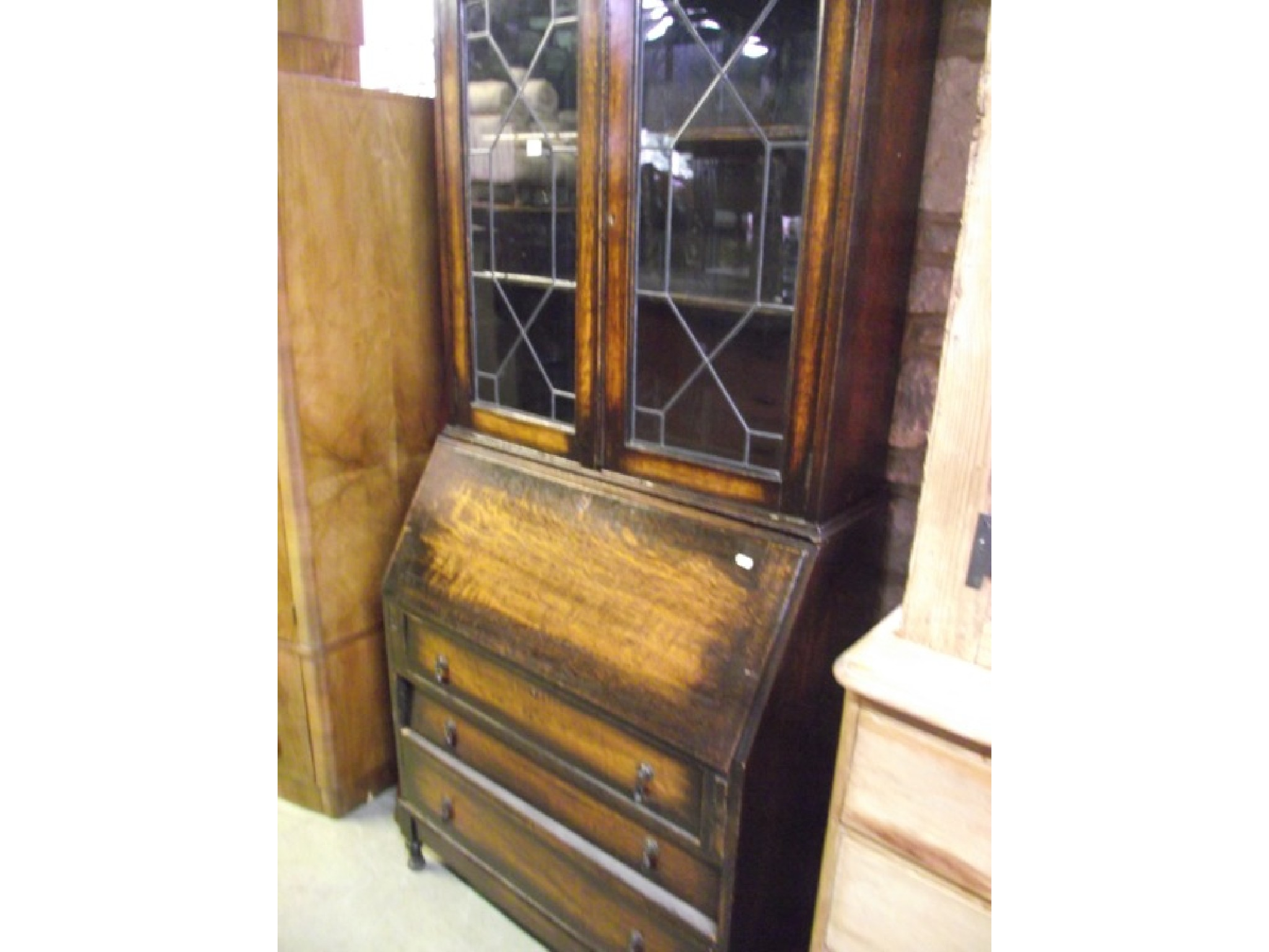 An early 20th century oak bureau bookcase the upper section