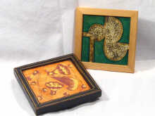A wooden framed Minton tile marked on the back Minton