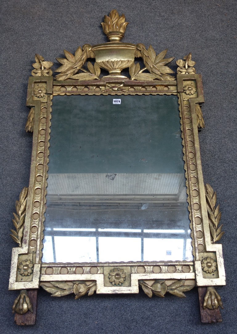 An 18th century French gilt framed wall mirror with flaming