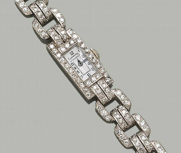 A lady s art deco diamond platinum and eighteen karat