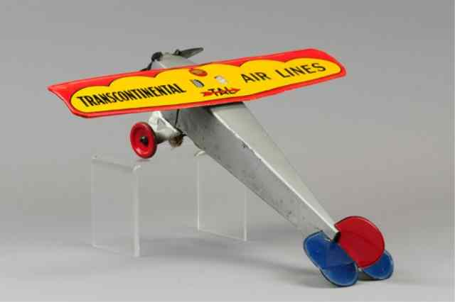 GIRARD TRANSCONTINENTAL AIRLINES Tinplate single wing airplane lithographed tin wing