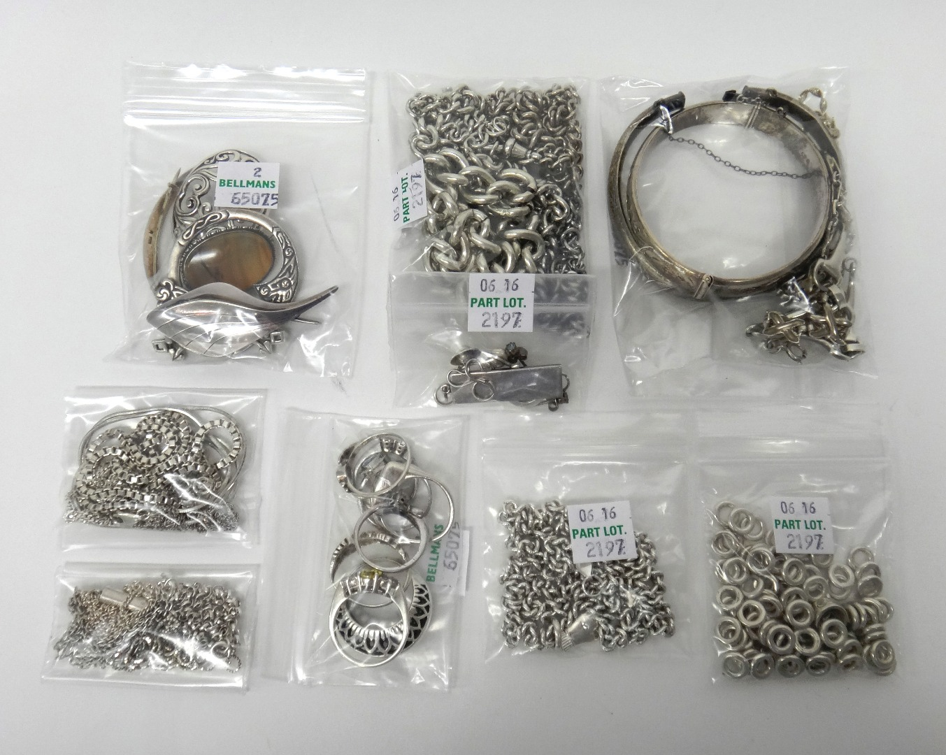 Mostly silver jewellery comprising a curb link neckchain with a