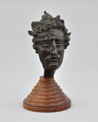 A Cast Bronze Mask of Apollo The modern cast bronze
