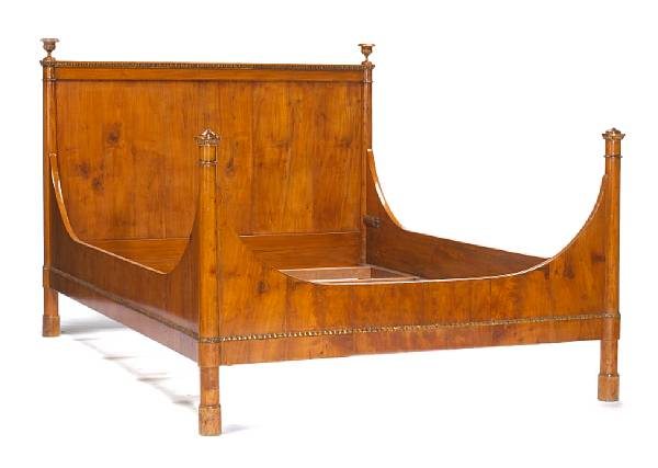 An Italian Neoclassical parcel gilt walnut bed early 19th century