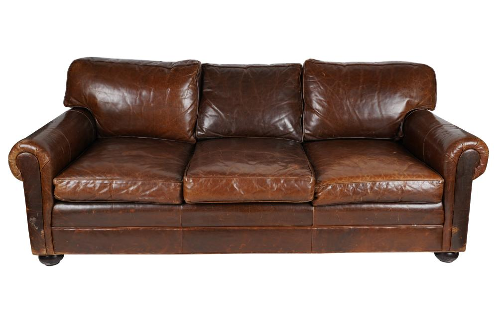 DISTRESSED BROWN LEATHER SOFAthe loose seat and back cushions reversing