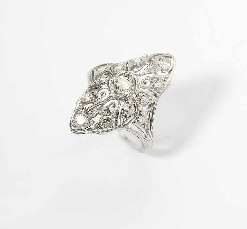 Platinum navette set with 13 old European cut diamonds totaling
