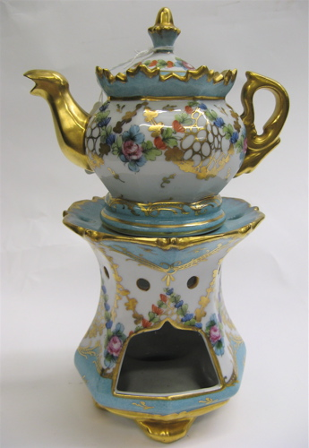 FRENCH TWO PART PORCELAIN VEILLEUSE hand decorated with multi colored
