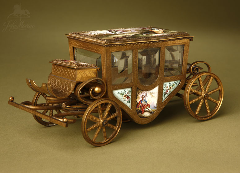 A French enameled gilt metal miniature carriage A French enameled