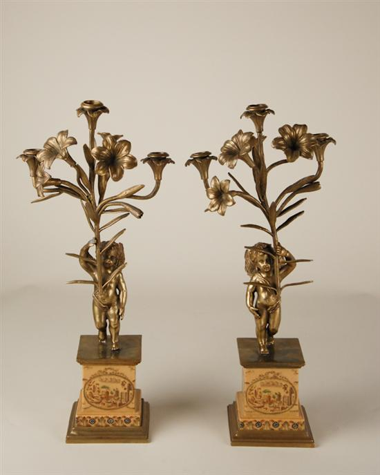 A Pair of Bronze Brass and Porcelain Candelabras triple branch