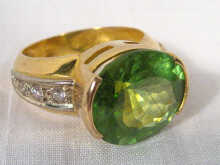 A yellow metal tests high carat gold peridot ring the