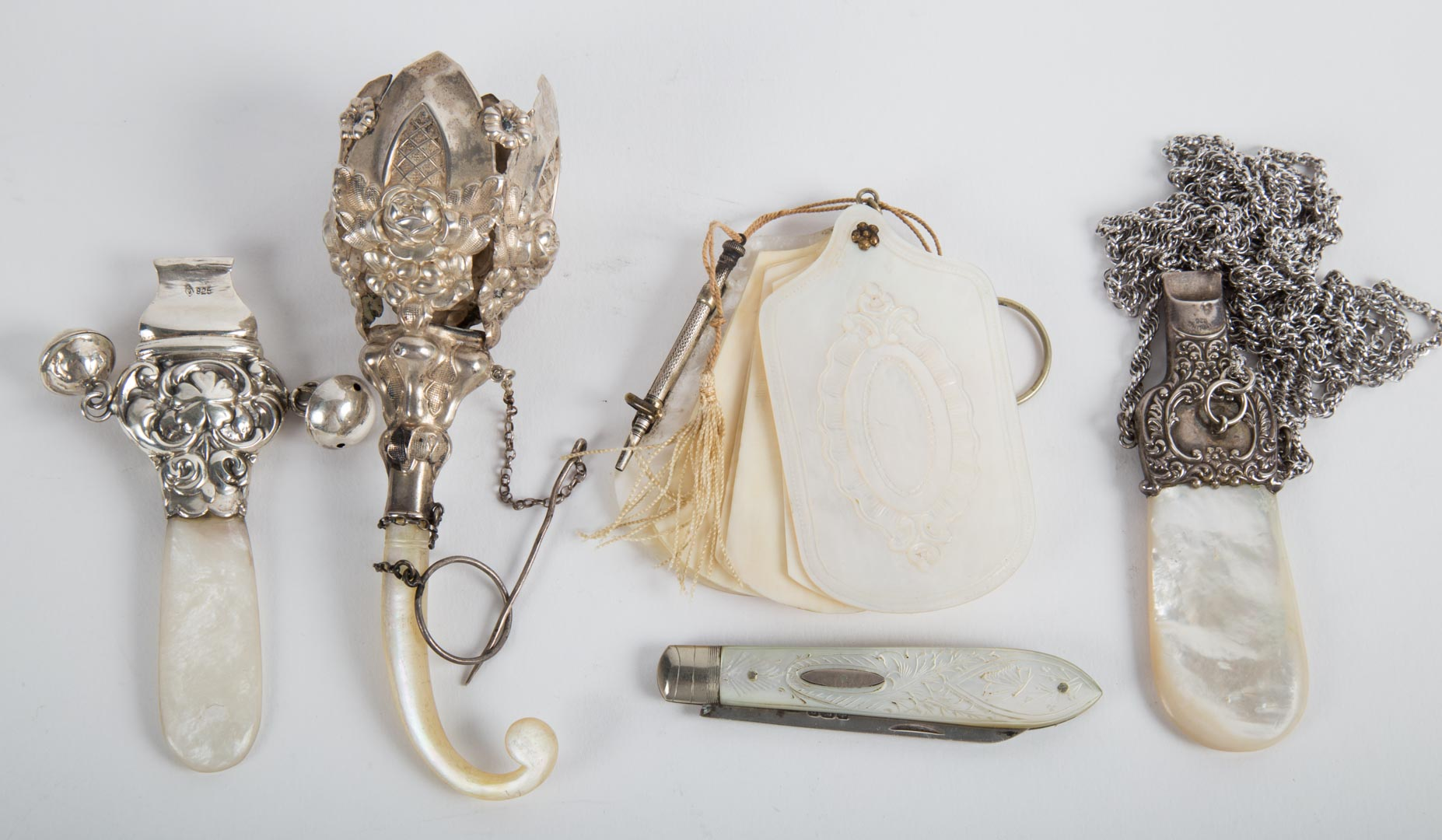 Mother of pearl sterling silver personal items including two whistles